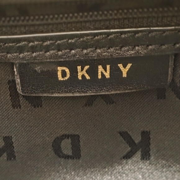 DKNY Bryant Medium Zippered Tote Bag in black leather with gold-tone hardware.  - Picture 3 of 17